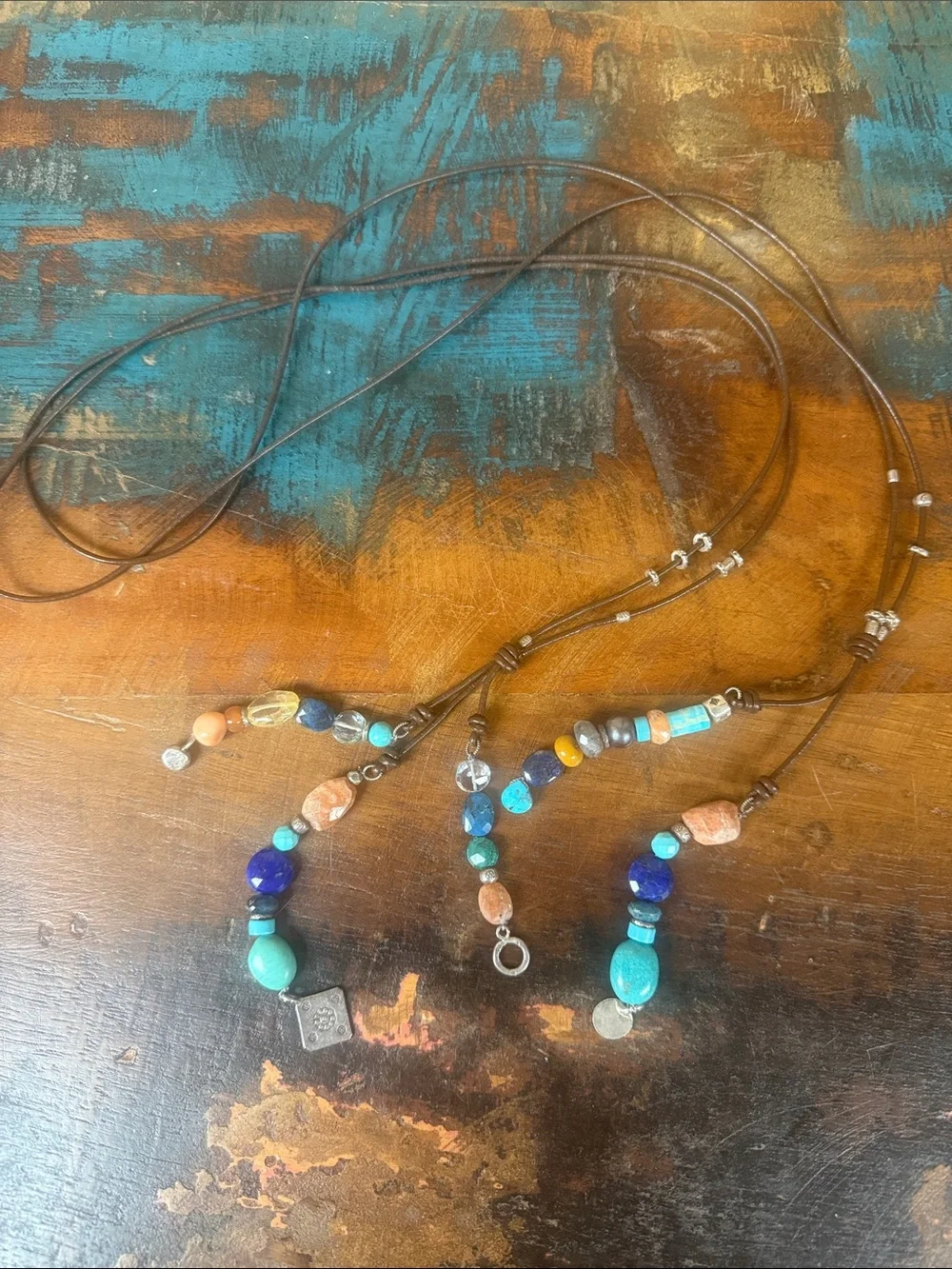 5 tassel lariat leather cord necklace. New with tags from Sundance.